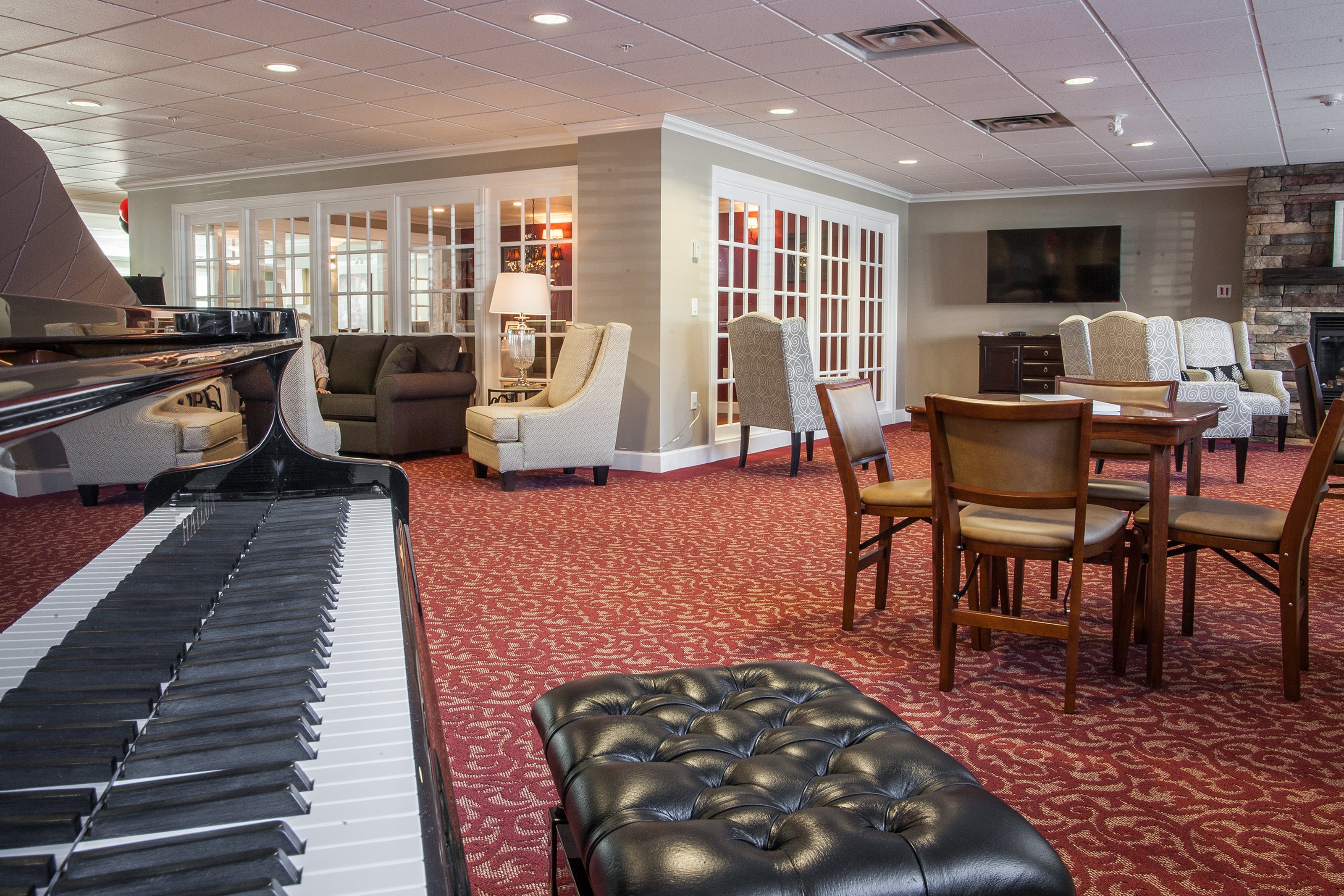 Relaxing area with piano at Cherry Park Retirement Residence in Penticton, BC.